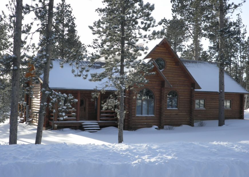 Log cabin during winter