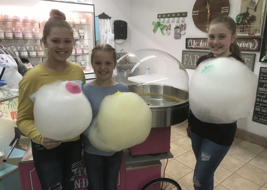 Kids At Shop Eating Cotton Candy